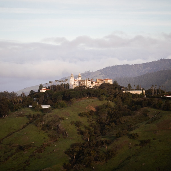 A view of Hearst Castle in the evening with both bell towers of Casa Grande visible.