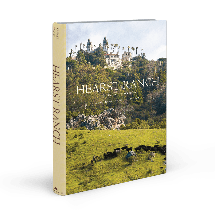 Hearst Ranch: Family, Land and Legacy by Victoria Kastner. The book is standing upright, showing the cover and spine. The cover has the Hearst Castle and Cattle on it.